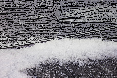 A detail of fake snow against a painted wall.