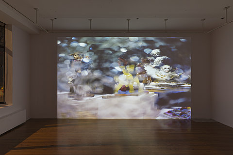 A large floor-to-ceiling projection on a white wall.