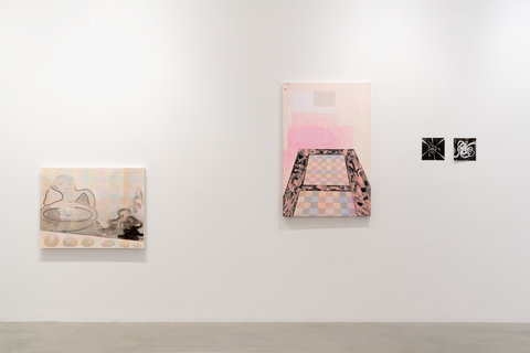 Installation view of four works in the exhibition. On the left, hanging lower to the ground is a painting of a wispy, sketched out being sitting at a table. Beside the figure is a pile of wispy, black smoke-like lines. The background is a grid of overlapping, muted pastels in a variety of colors. The next work is hung higher up off the ground and features what looks like a pink room with a checkered floor pattern. The next two works are smaller squares and consist of white knots/rope/jumble of lines against a black background. 