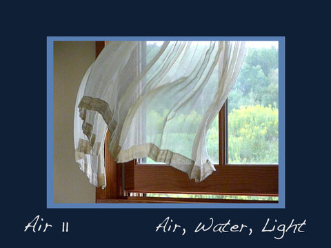 Image of a chiffon curtain blowing in an open window. The image is outlined with a skinny light blue frame and a wider dark blue frame. On the bottom of the frame are the words "Air II" and then "Air, water, light."