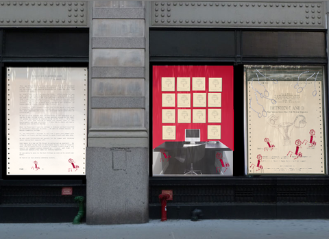 Windows installation image from street view, featuring all three windows. From left to right: the left most window features an enlarged piece of paper. The words are illegible from the image, however there are two figures sketched in red on the bottom of the page, which takes up the entire window. In the middle, is an installation which mimics an office cubicle. Inside there is a desk with a computer and keyboard. In front of the desk is a chair. Behind the desk, on the wall is a red background with pieces of white paper in a four by four pattern. In the right window, is another enlarged paper with more red sketched out figures drawn over it. The words are hard to read, but the title of the page says "Between C and D." 
